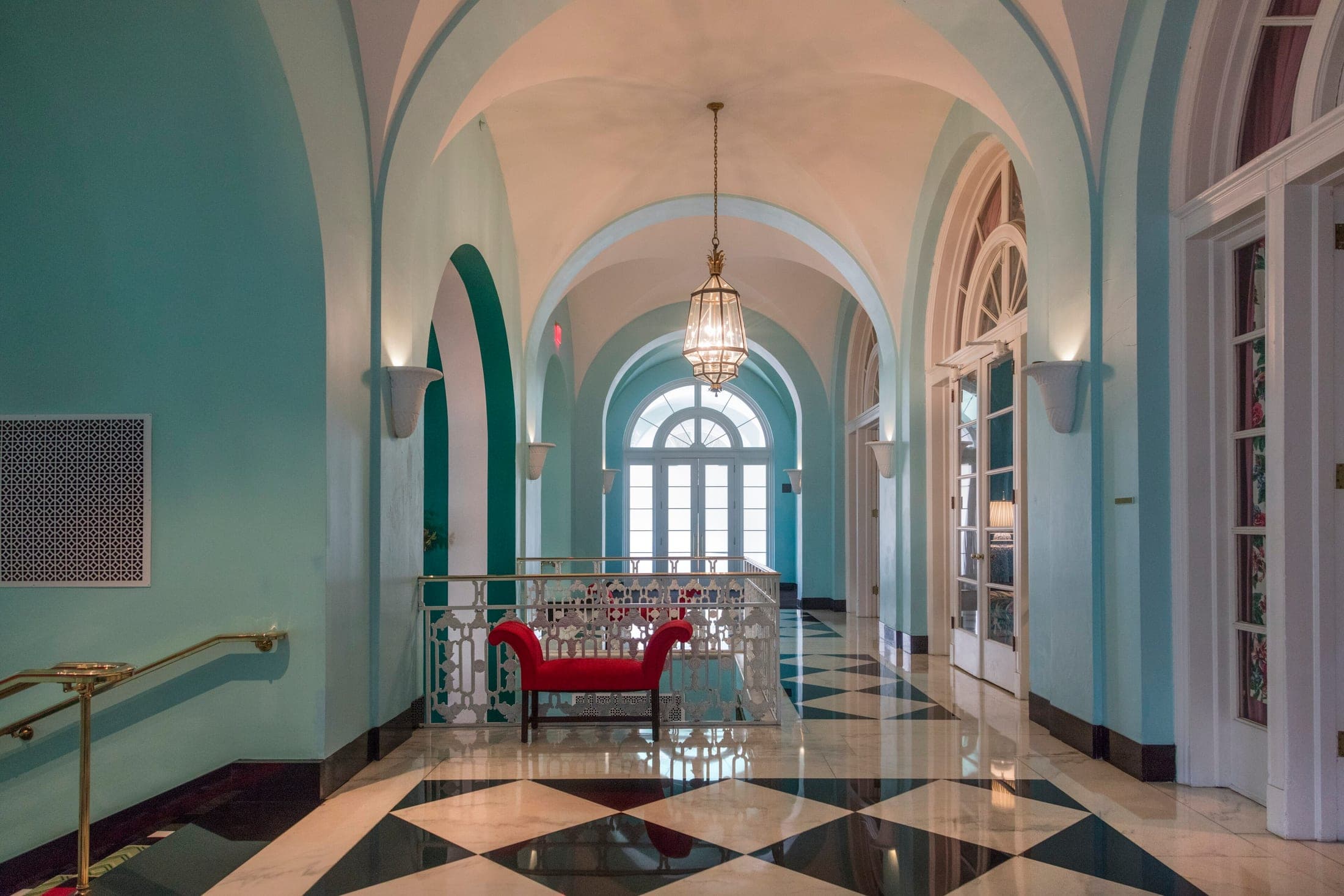 Dorothy Draper–decorated hallway inside The Greenbrier resort hotel